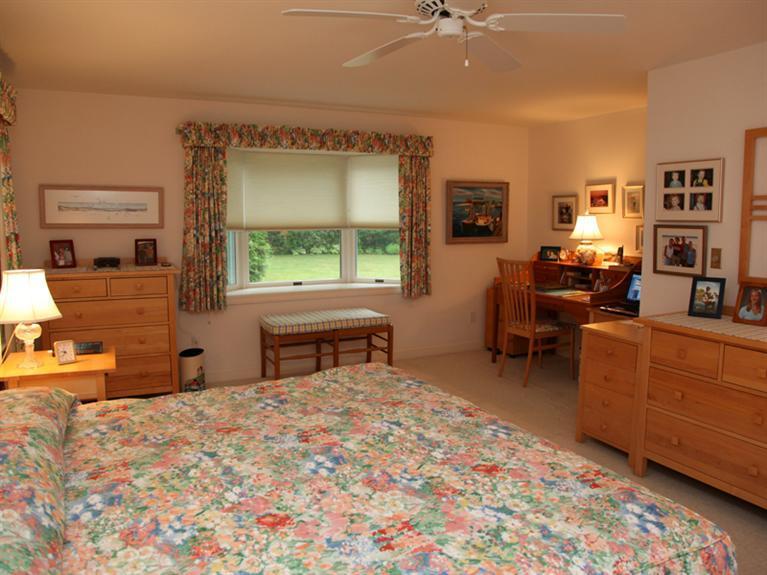 105 Scudder Road Osterville, MA 02655 - Photo 10 of 10 a bed room with a bed and a chair