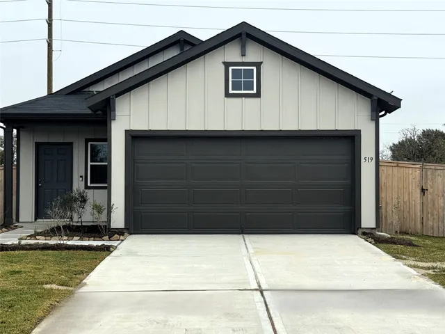a view of house with garage