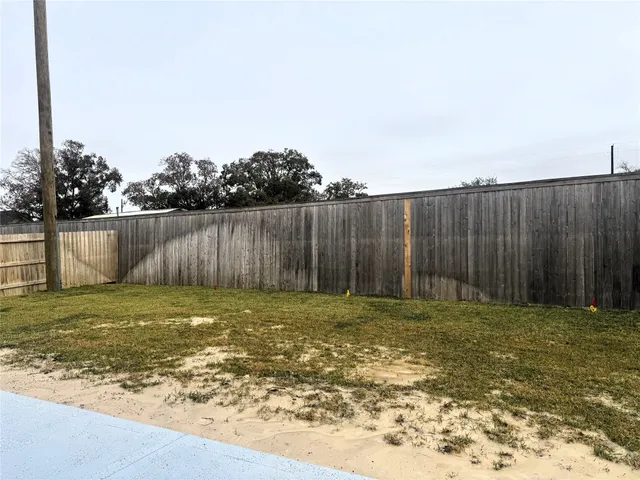 a view of outdoor space with wooden fence