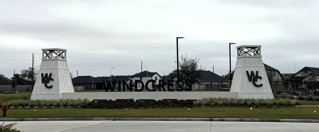 a view of a park with potted plants