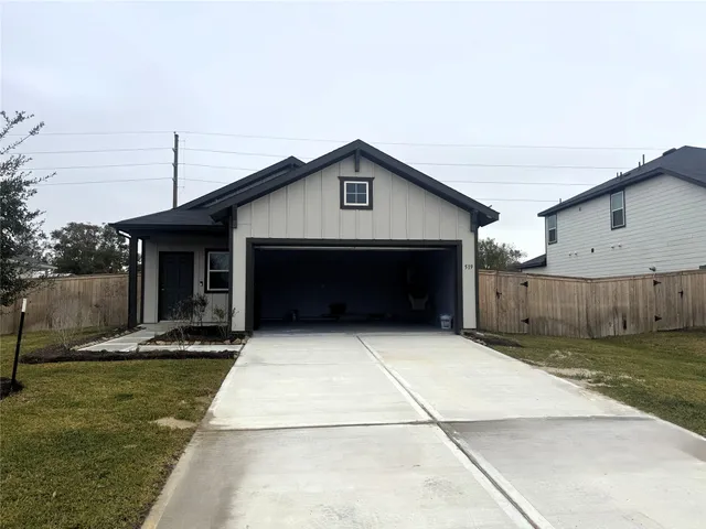 a front view of a house with garage