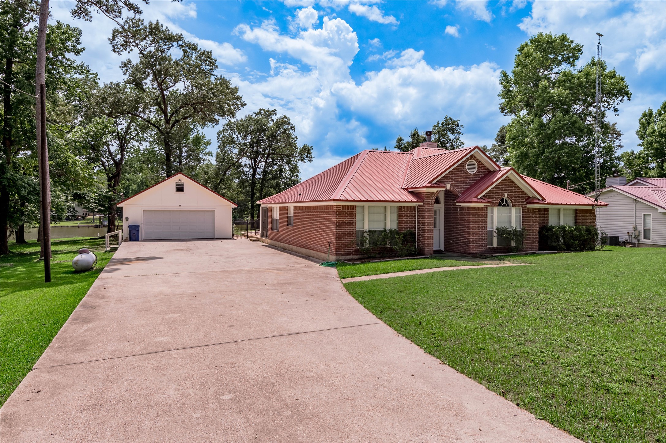 324 Red Oak Lane Trinity, TX 75862 - Photo 2 of 49 a front view of house with yard and green space