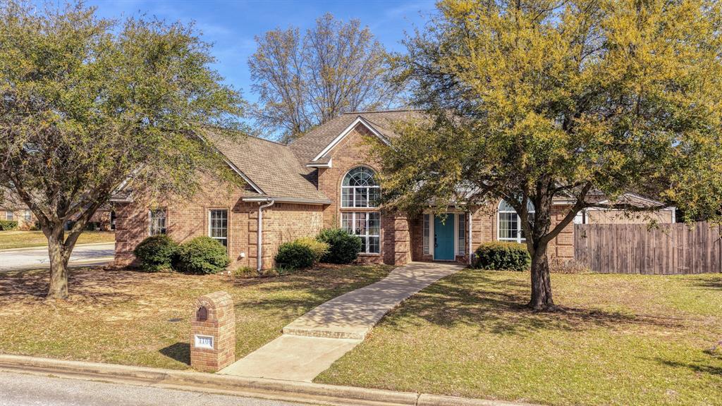 1106 Owl Street Decatur, TX 76234 - Photo 1 of 40 a front view of a house with a yard