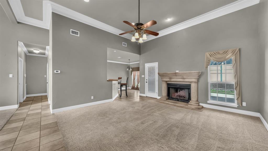 1106 Owl Street Decatur, TX 76234 - Photo 14 of 40 a view of an empty room with a fireplace