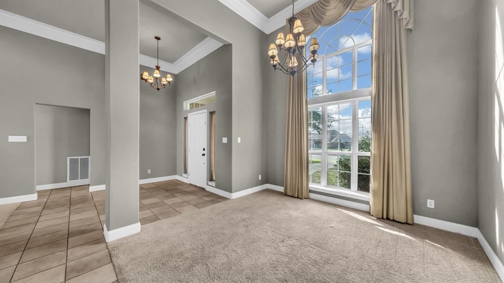 1106 Owl Street Decatur, TX 76234 - Photo 24 of 40 a view of a big room with windows and chandelier