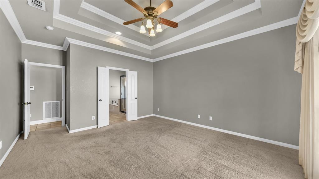 1106 Owl Street Decatur, TX 76234 - Photo 28 of 40 a view of an empty room with a ceiling fan