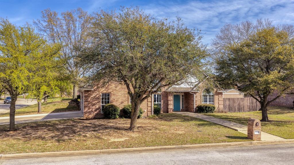 1106 Owl Street Decatur, TX 76234 - Photo 4 of 40 a front view of a house with a yard