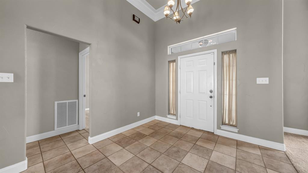 1106 Owl Street Decatur, TX 76234 - Photo 7 of 40 a view of an empty room with window