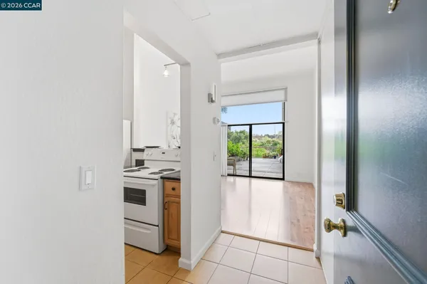 a bathroom with a granite countertop toilet sink and mirror