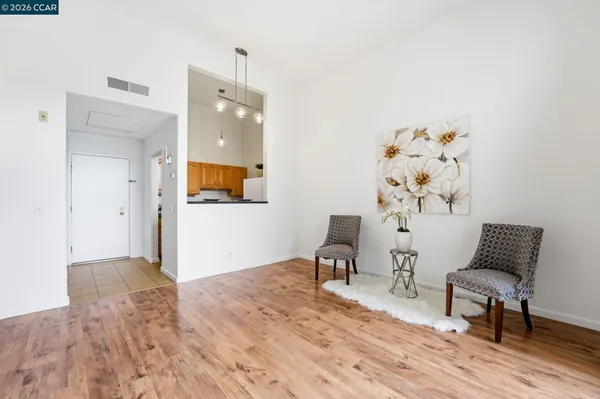 a kitchen with a stove top oven and cabinets