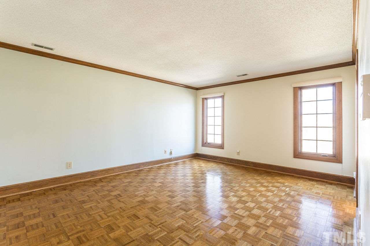 8816 Stage Ford Road Raleigh, NC 27615 - Photo 16 of 29 With Parquet Floors, and 'smart' motorized Hunter Douglas room-darkening shades, walk-in closet, and updated en-suite bathroom