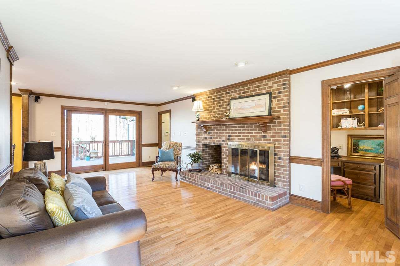 8816 Stage Ford Road Raleigh, NC 27615 - Photo 10 of 29 with window seat, built-in bookcase, Gas Log Fireplace, raised hearth, and an office nook! Already pre-wired for TV/Media
