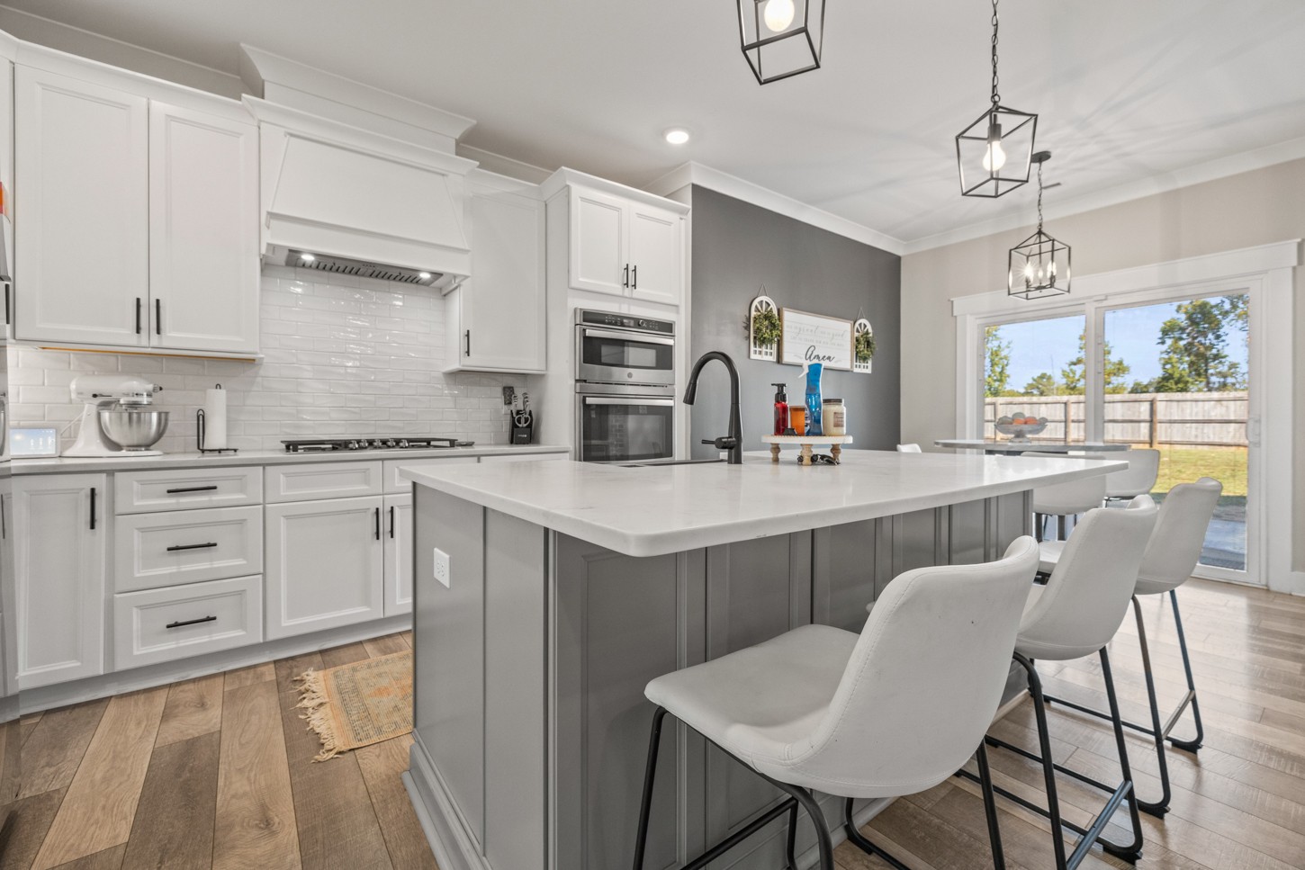 27 Hancock Road Fayetteville, TN 37334 - Photo 15 of 47 a kitchen with a refrigerator a sink dishwasher a stove and white cabinets with wooden floor