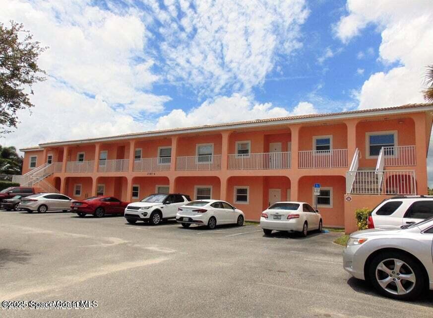 a view of a cars parked in front of a building