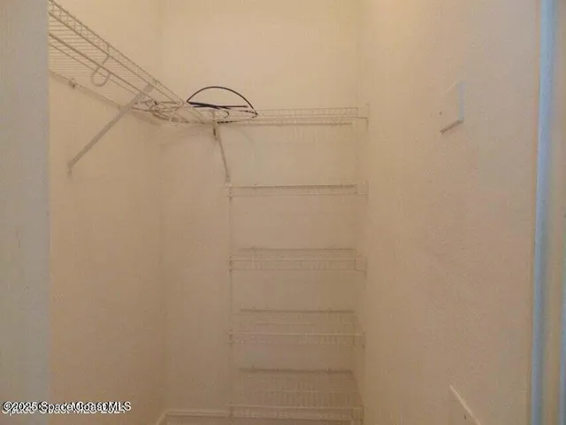 a view of small space with racks on the wall