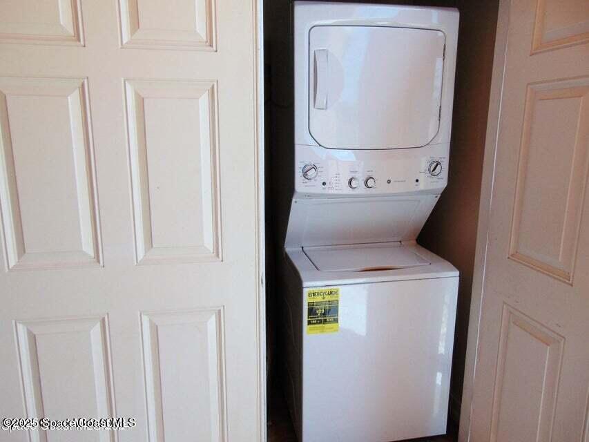 2087 Hidden Grove Lane, Unit 105B Merritt Island, FL 32953 - Photo 21 of 22 a utility room with dryer and washer
