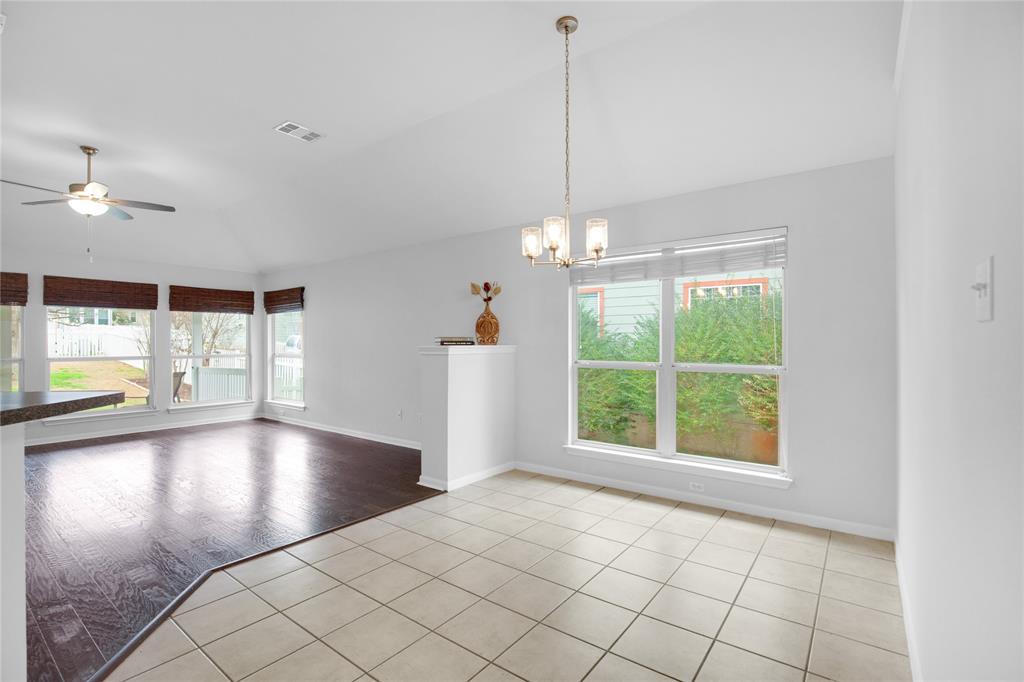 281 Hutton Kyle, TX 78640 - Photo 37 of 37 An open floorplan seamlessly connects spaces, featuring diverse flooring and ample natural illumination.