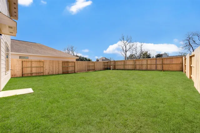 a view of a backyard with a garden and plants