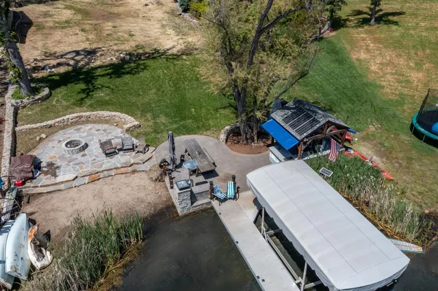 an aerial view of a house with outdoor space