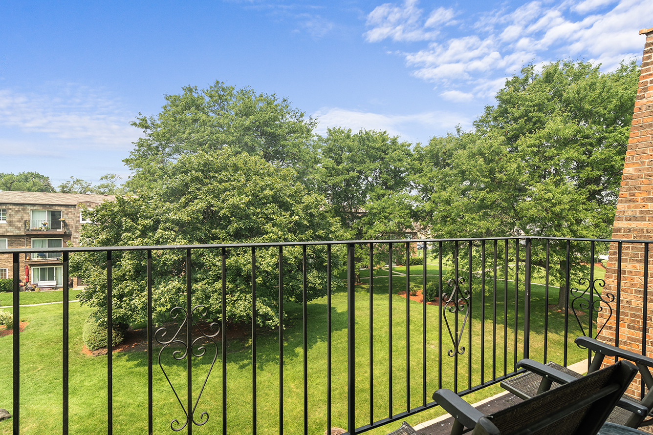 9390 Bay Colony Drive, Unit 3N Des Plaines, IL 60016 - Photo 11 of 15 a view of a balcony with lake view and a floor to ceiling window next to a lake view