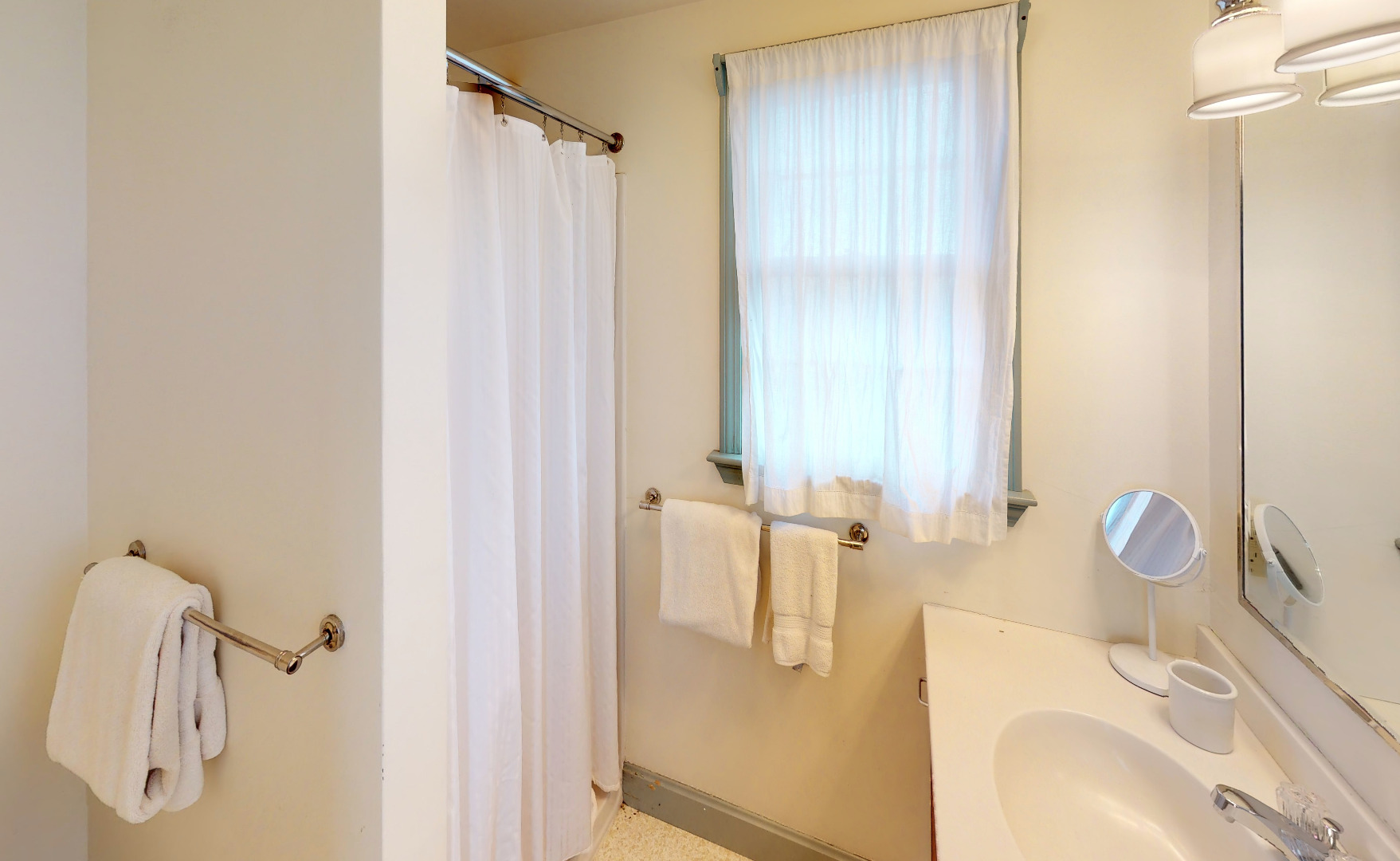 43 West Miacomet Road Nantucket, MA 02554 - Photo 14 of 22 a bathroom with a sink a mirror and shower