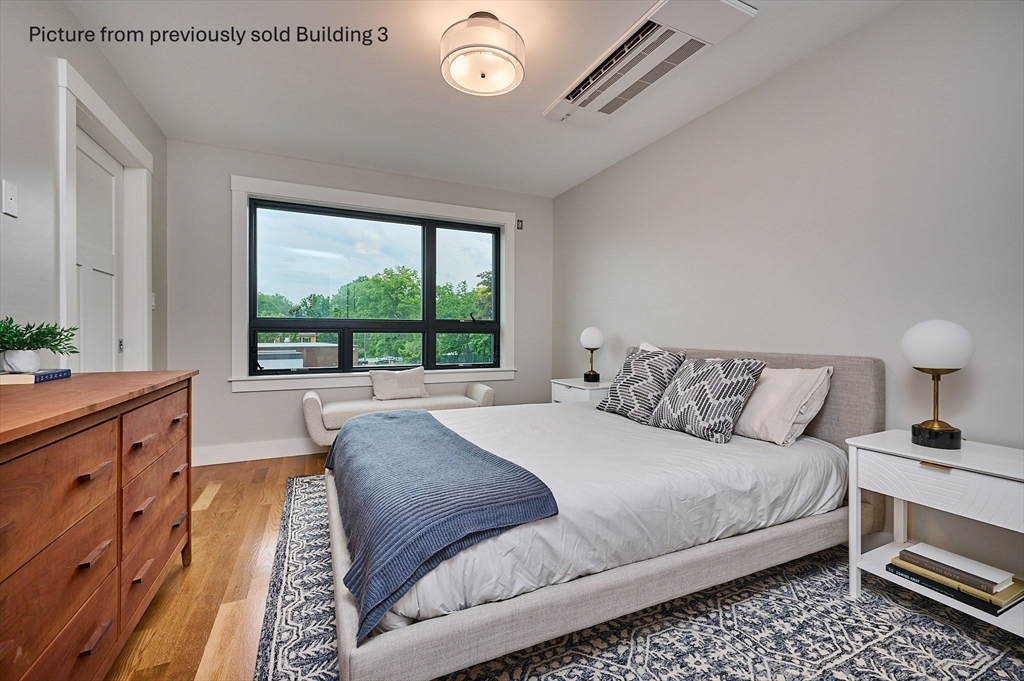 10 Hawley Street, Unit 4C Northampton, MA 01060 - Photo 11 of 23 a bedroom with a large bed and a large window