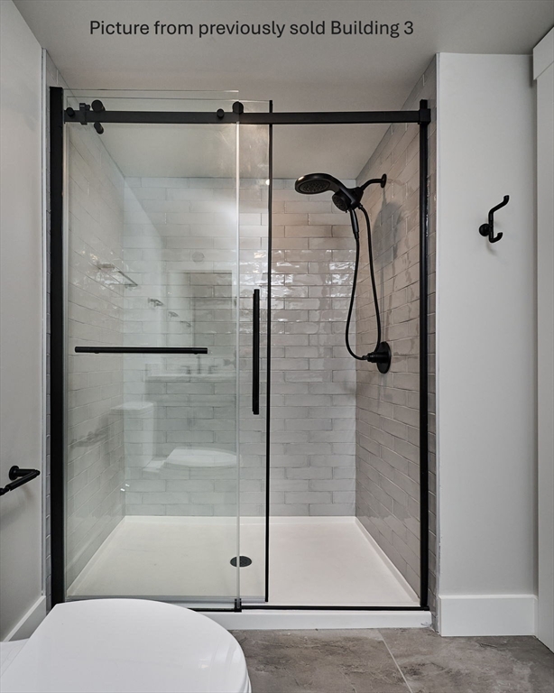 10 Hawley Street, Unit 4C Northampton, MA 01060 - Photo 12 of 23 a bathroom with a glass shower door