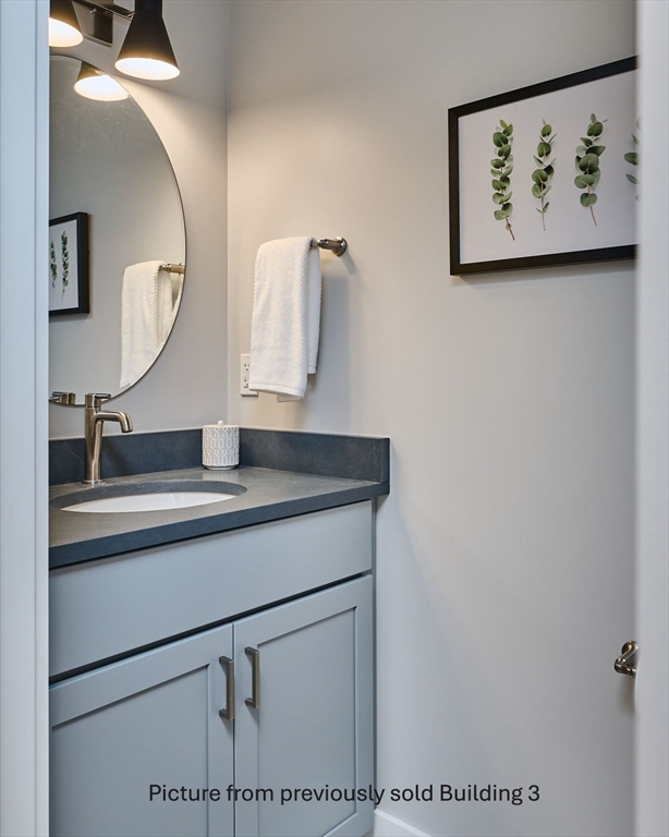 10 Hawley Street, Unit 4C Northampton, MA 01060 - Photo 17 of 23 a bathroom with a sink and a mirror
