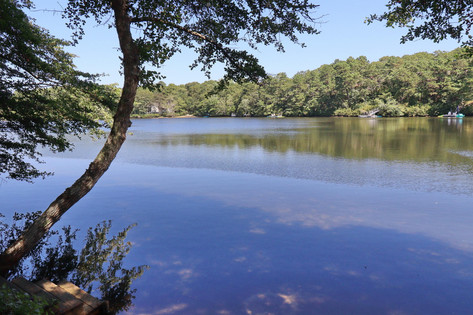 120 Fells Pond Road Mashpee, MA 02649 - Photo 1 of 42 a view of a lake with a city