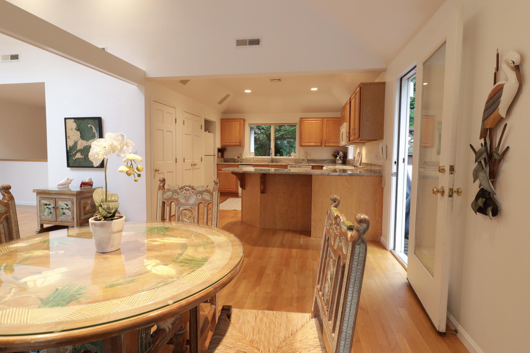 120 Fells Pond Road Mashpee, MA 02649 - Photo 14 of 42 a kitchen with stainless steel appliances kitchen island granite countertop a refrigerator a sink a stove and island