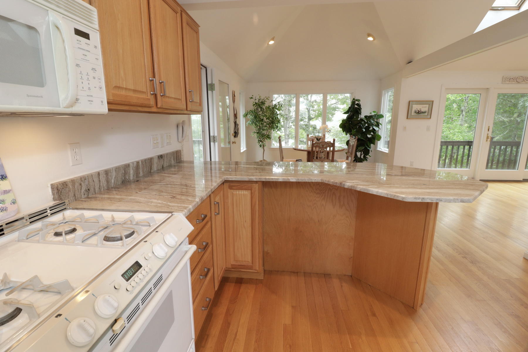 120 Fells Pond Road Mashpee, MA 02649 - Photo 15 of 42 a kitchen with a sink stove and cabinets