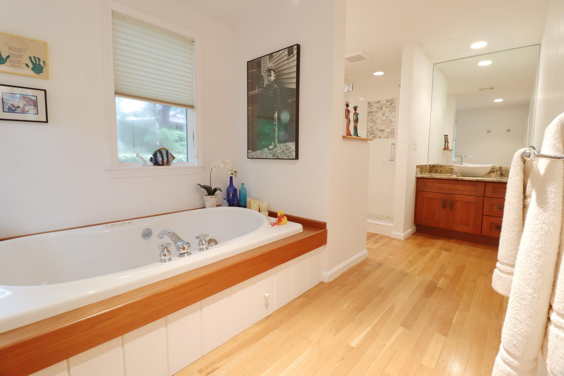 120 Fells Pond Road Mashpee, MA 02649 - Photo 22 of 42 a spacious bathroom with a tub sink and mirror