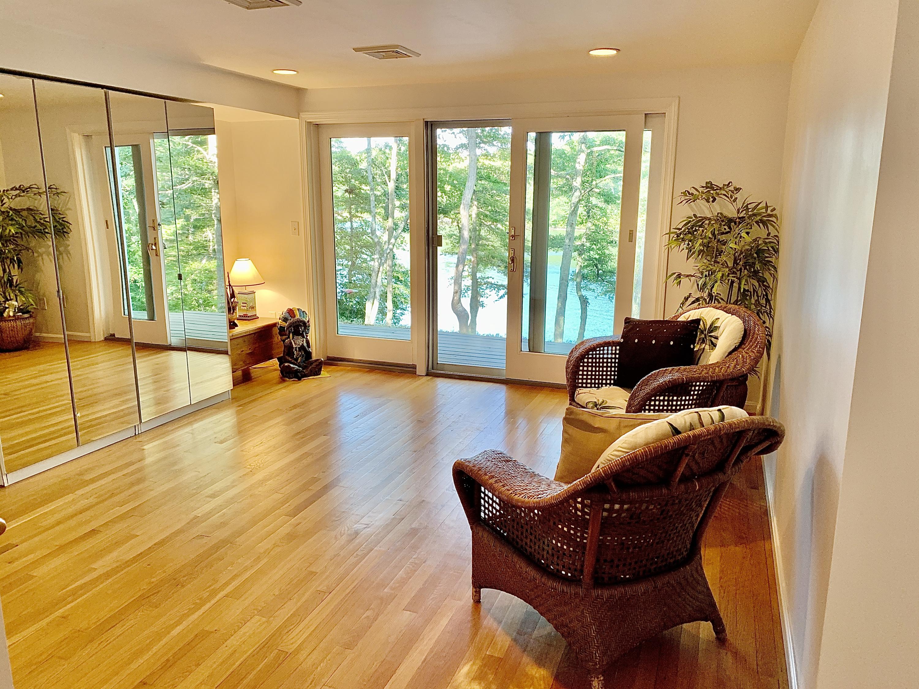 120 Fells Pond Road Mashpee, MA 02649 - Photo 26 of 42 a living room with furniture and a large window