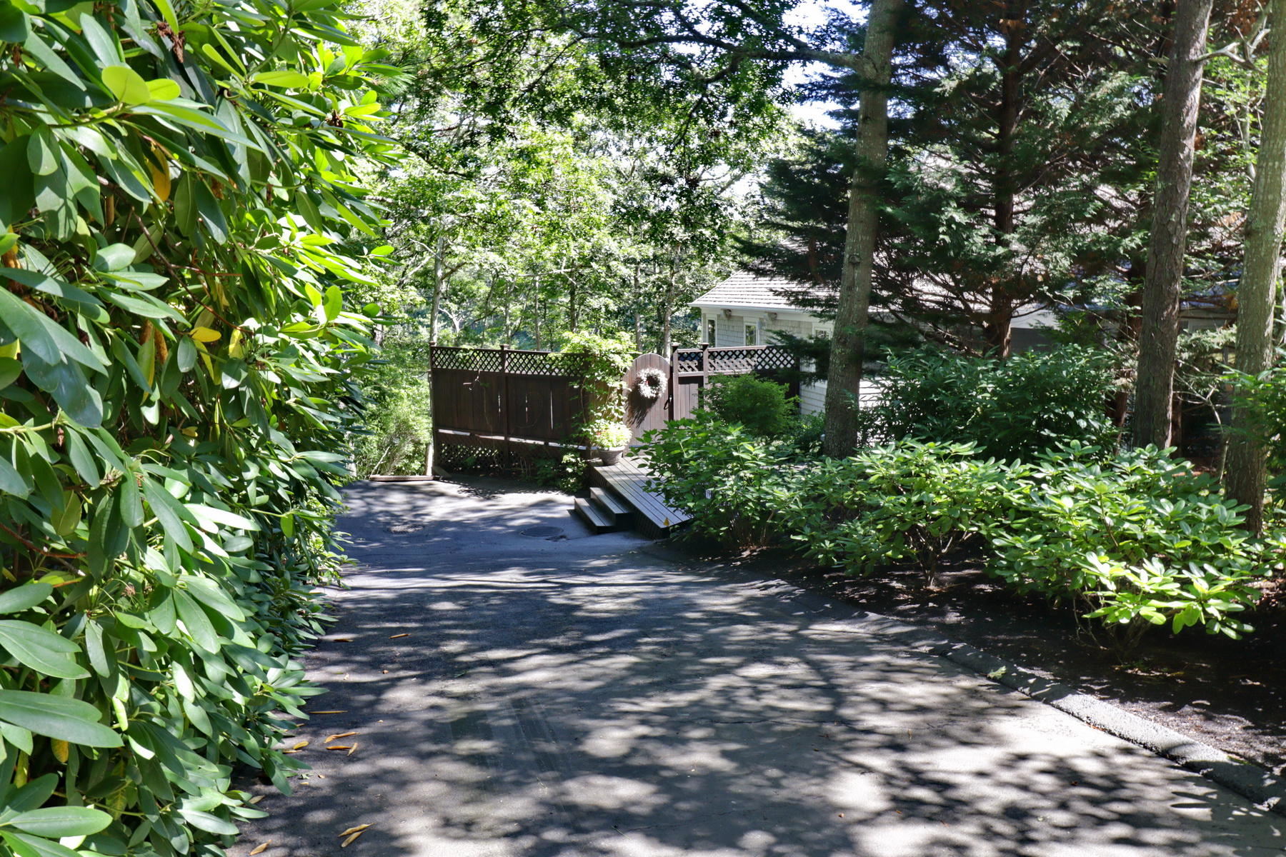 120 Fells Pond Road Mashpee, MA 02649 - Photo 3 of 42 a backyard of a house with lots of green space
