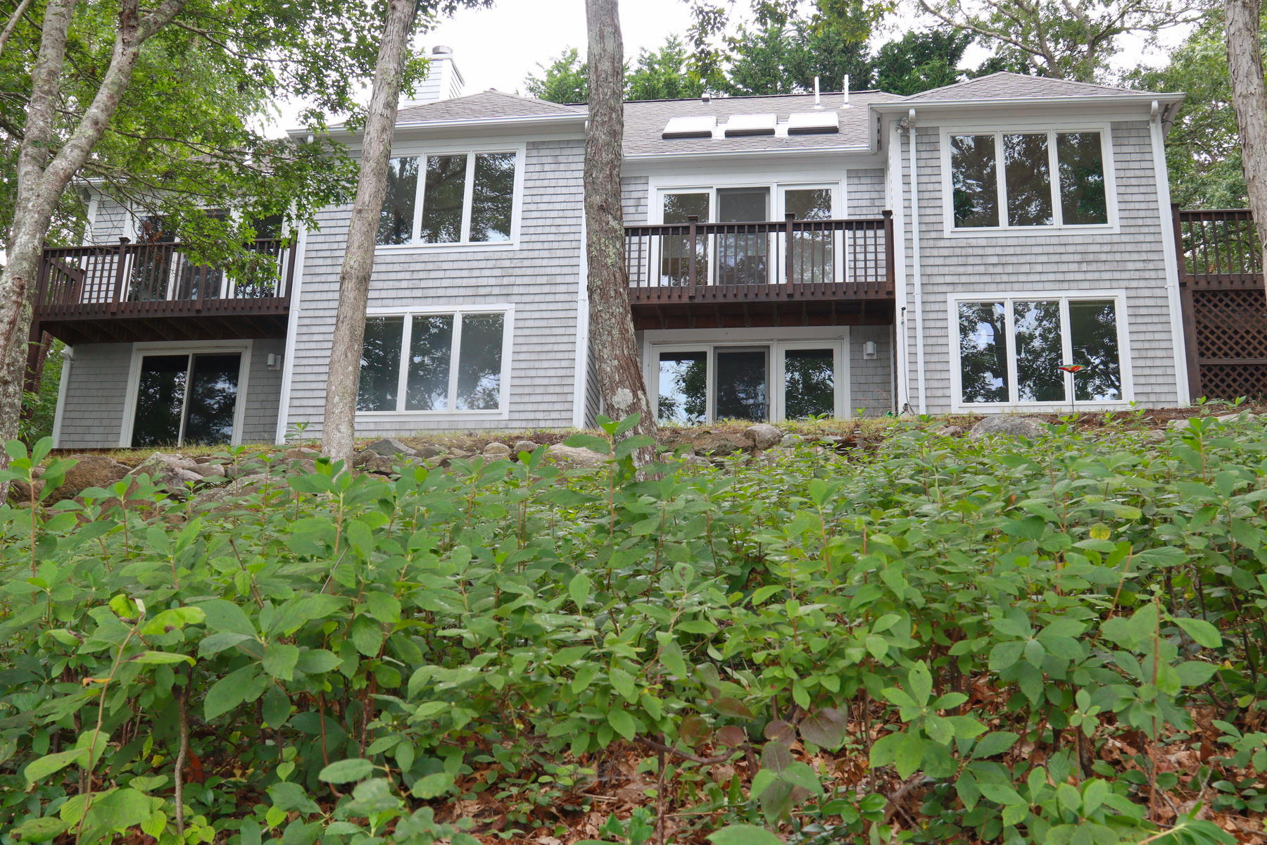 120 Fells Pond Road Mashpee, MA 02649 - Photo 42 of 42 a front view of a house with a garden