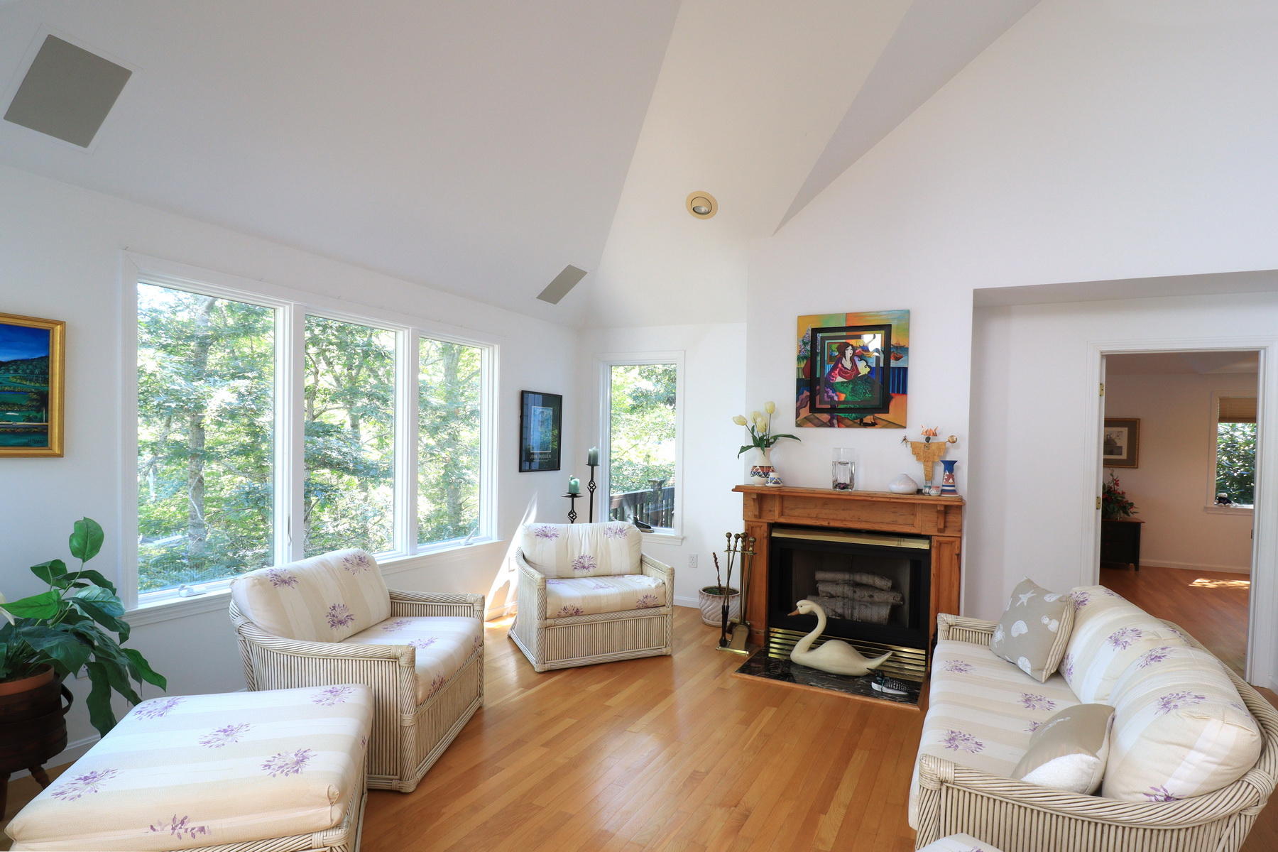 120 Fells Pond Road Mashpee, MA 02649 - Photo 8 of 42 a living room with furniture a large window and a fireplace