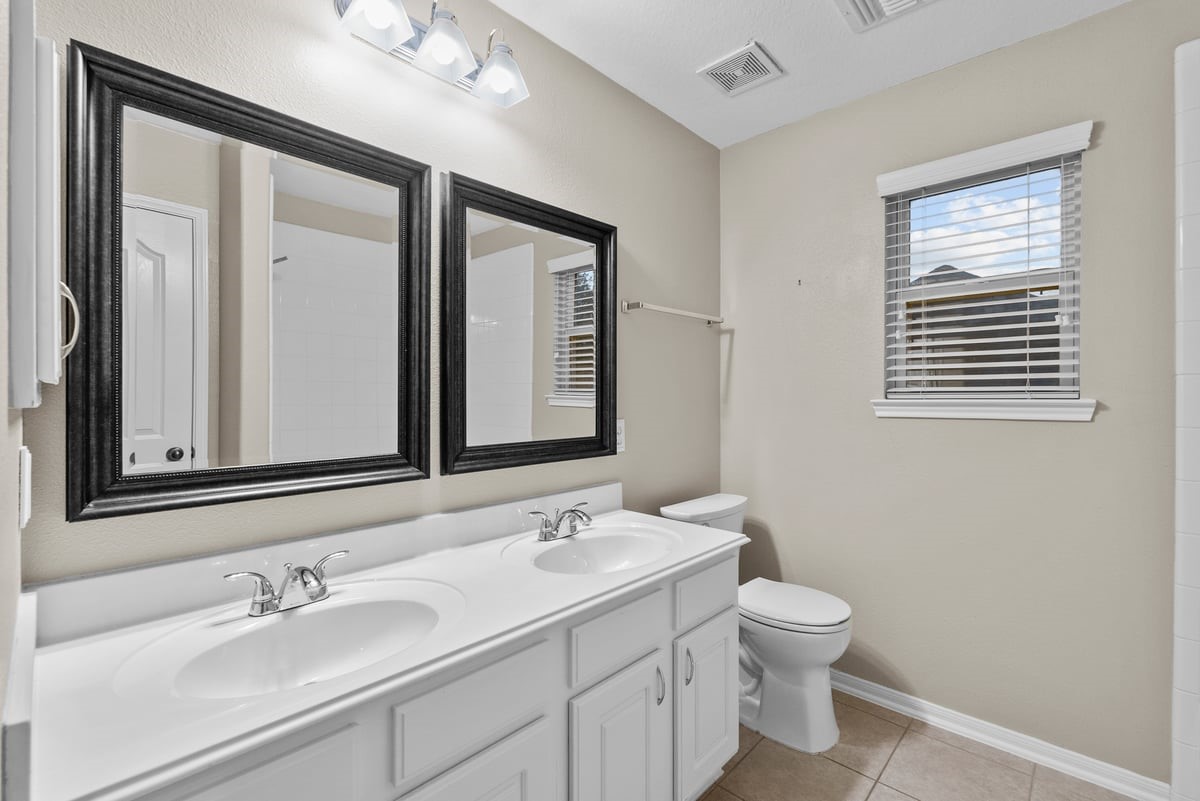 2231 Water Way Seabrook, TX 77586 - Photo 11 of 43 a bathroom with a sink a toilet and mirror