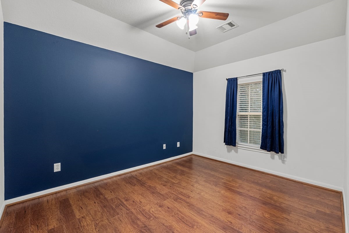 2231 Water Way Seabrook, TX 77586 - Photo 13 of 43 an empty room with wooden floor and windows