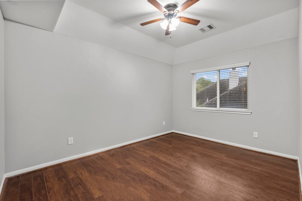 2231 Water Way Seabrook, TX 77586 - Photo 15 of 43 wooden floor in an empty room with a window
