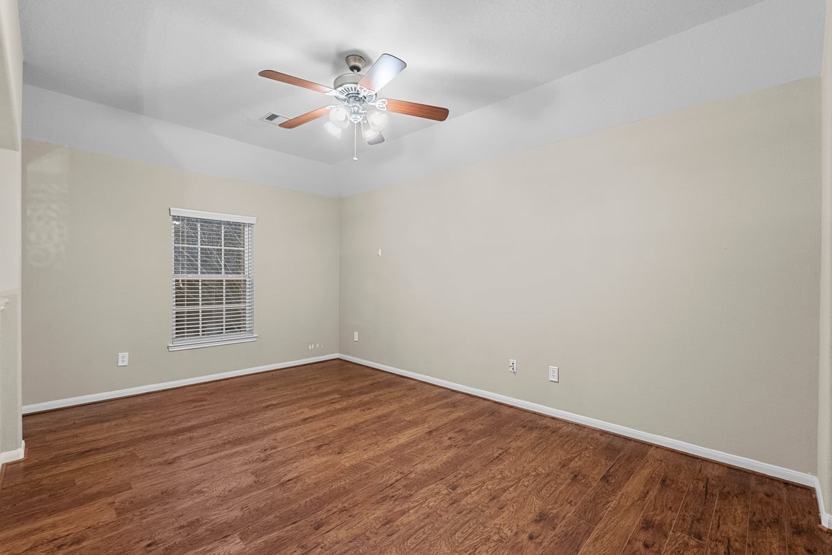 2231 Water Way Seabrook, TX 77586 - Photo 21 of 43 wooden floor in an empty room with a window