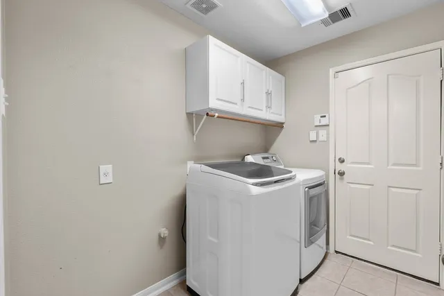 a kitchen with granite countertop a stove top oven microwave and cabinets