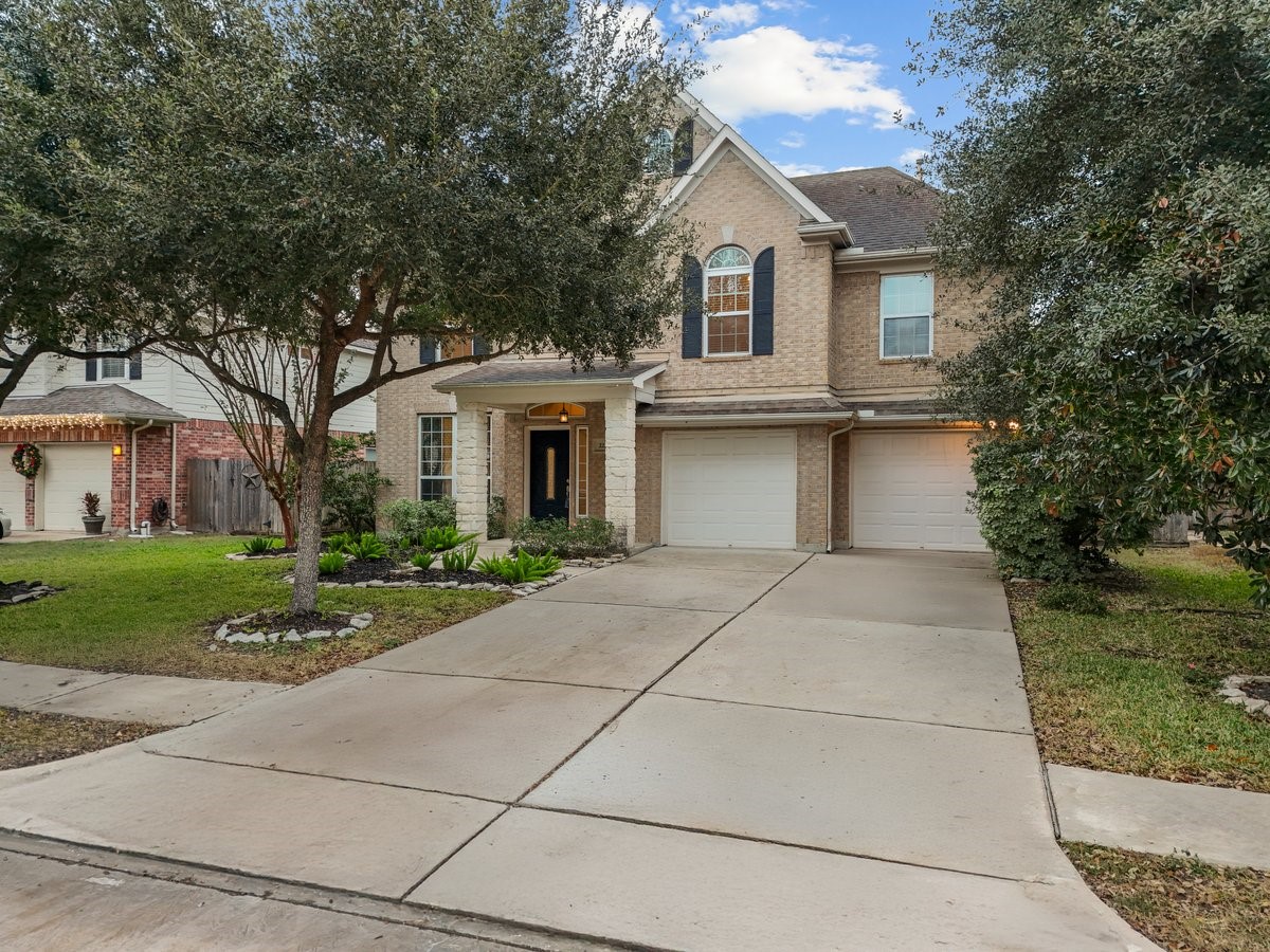 2231 Water Way Seabrook, TX 77586 - Photo 3 of 43 a front view of a house with a yard and trees