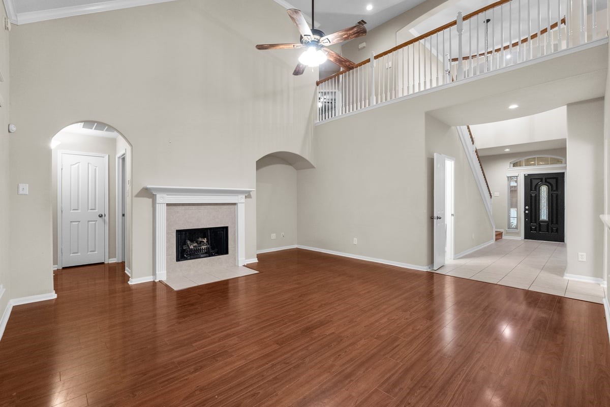 2231 Water Way Seabrook, TX 77586 - Photo 33 of 43 a view of an empty room with wooden floor fireplace and a window