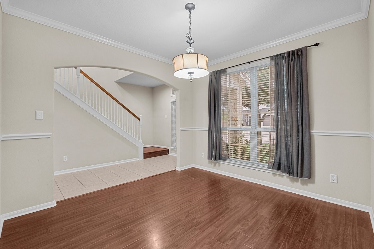 2231 Water Way Seabrook, TX 77586 - Photo 6 of 43 a view of an empty room with wooden floor and windows