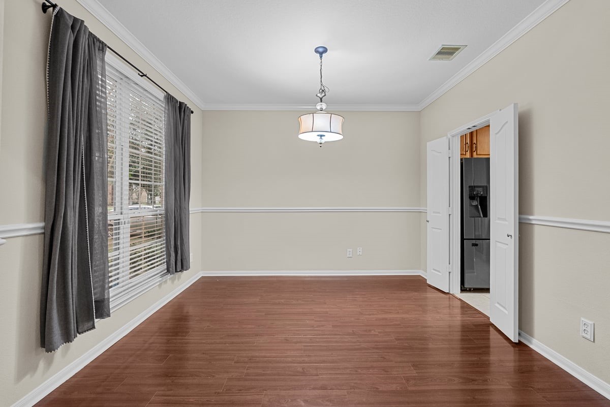 2231 Water Way Seabrook, TX 77586 - Photo 7 of 43 an empty room with wooden floor and windows