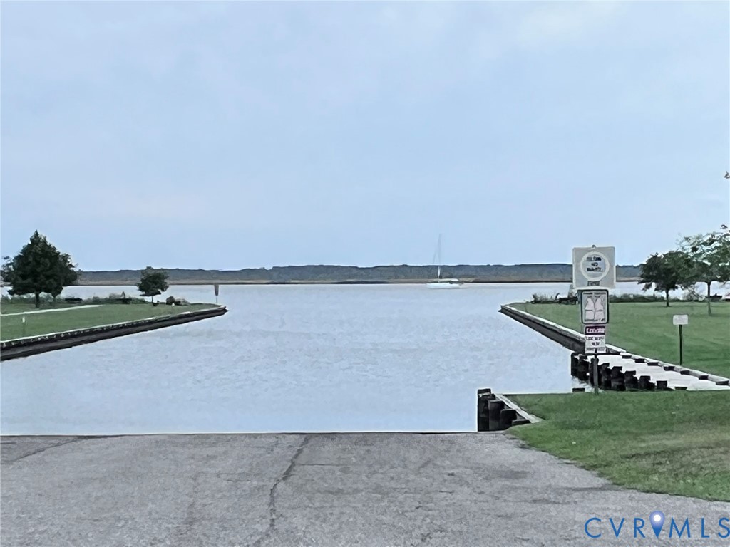 1832 Munden Point Road Virginia Beach, VA 23457 - Photo 16 of 16 a view of a lake with a yard and large trees