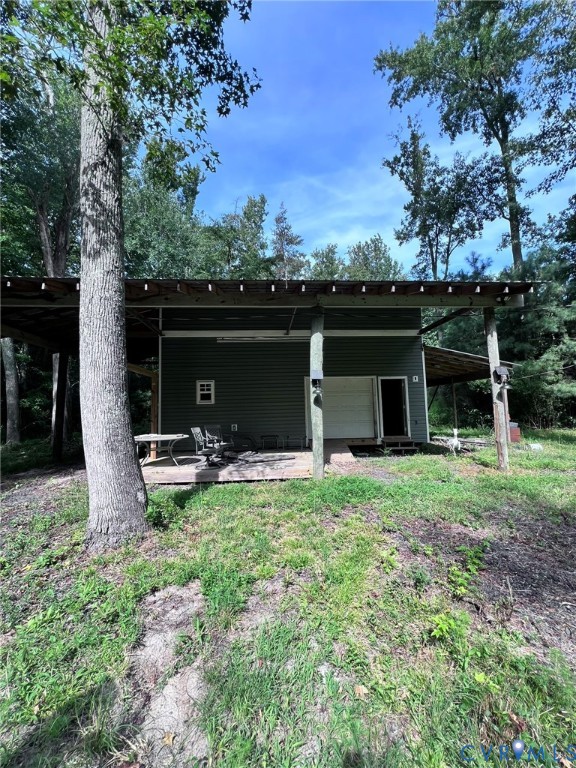 1832 Munden Point Road Virginia Beach, VA 23457 - Photo 2 of 16 a view of a house with backyard and porch