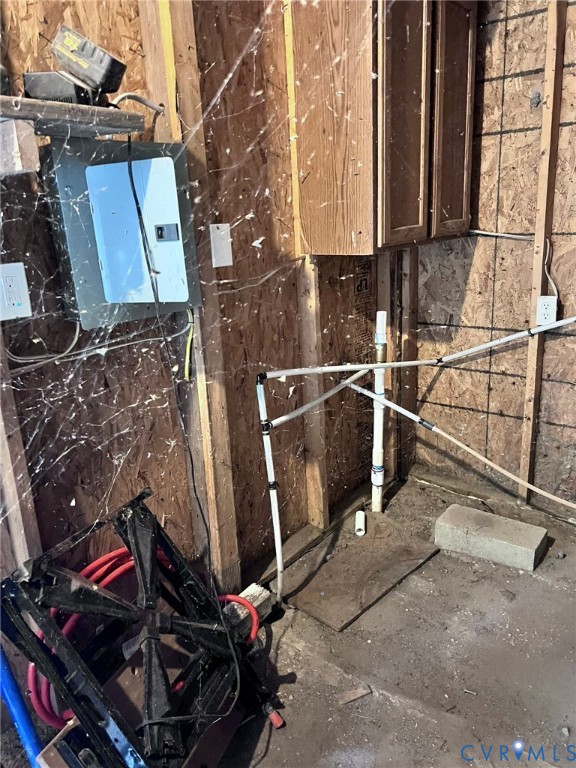 1832 Munden Point Road Virginia Beach, VA 23457 - Photo 9 of 16 a room with water heater and wooden cabinets