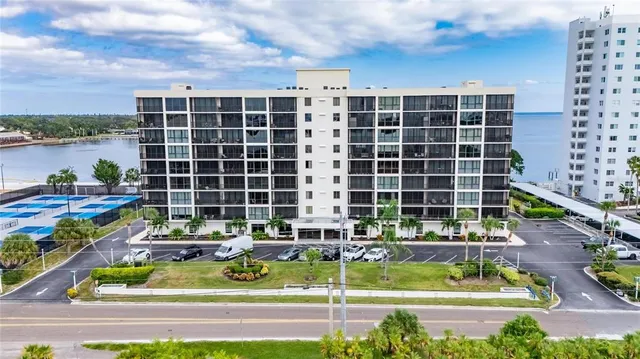 a view of swimming pool with outdoor seating and plants