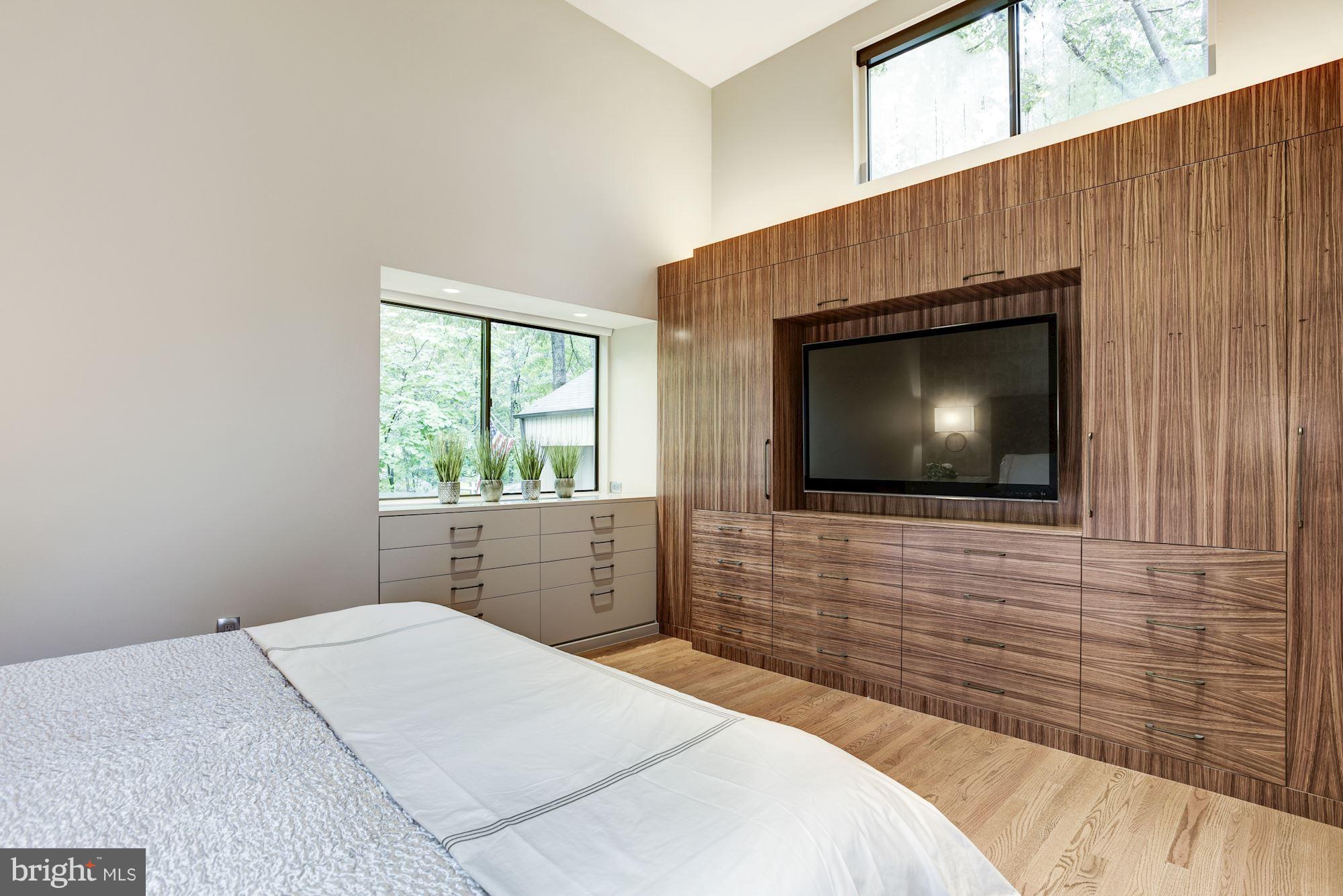 2119 Owls Cove Lane Reston, VA 20191 - Photo 15 of 30 a bedroom with a bed and a flat screen tv